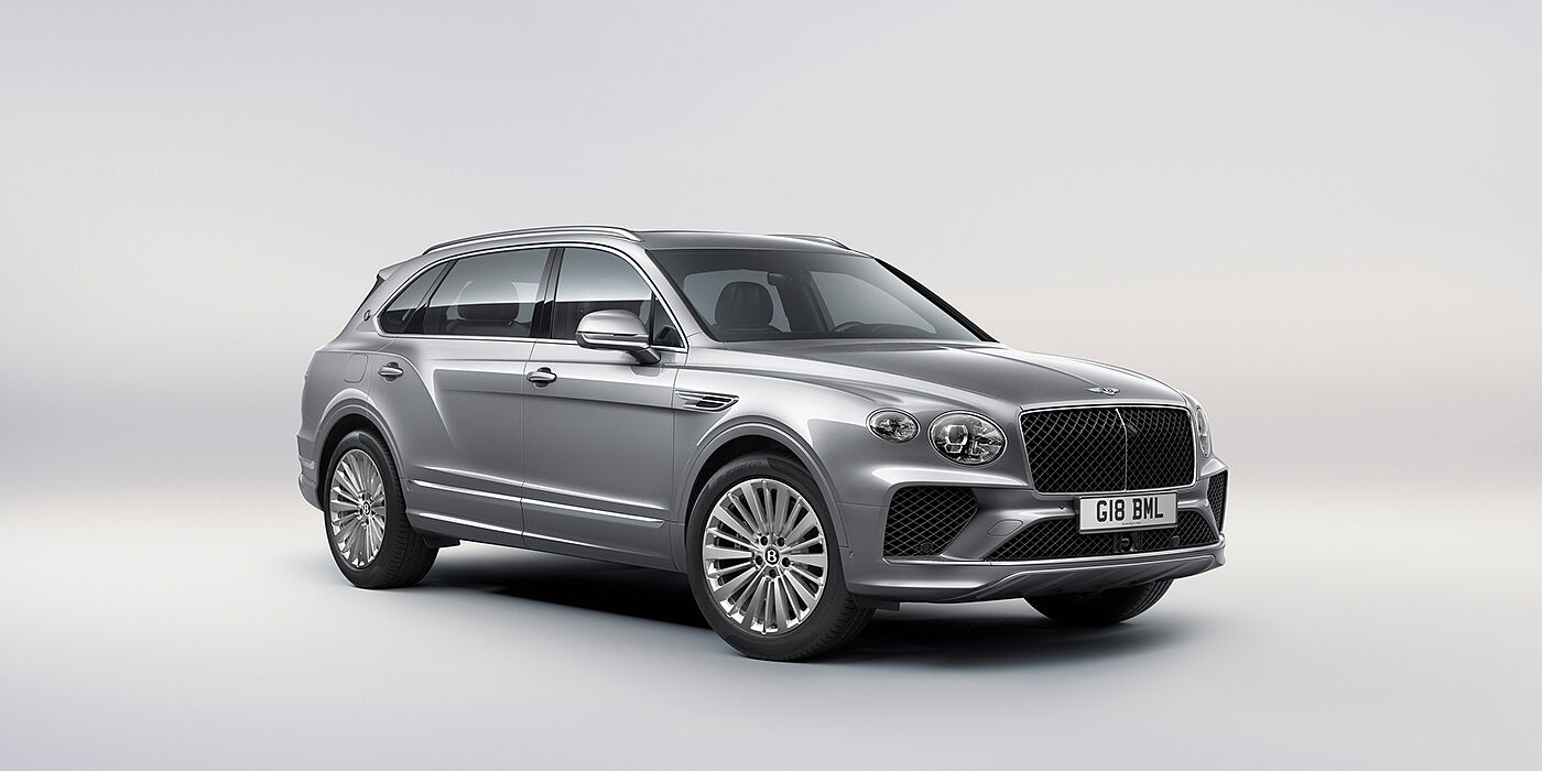 Bentley Porto Bentley Bentayga Extended Wheelbase luxury SUV front three quarter view in Moonbeam paint with 21 inch five spoke painted wheels