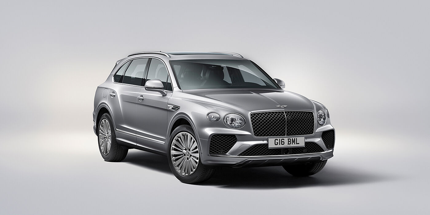Bentley Porto Bentley Bentayga luxury SUV front three quarter view in Moonbeam paint with matrix grille and 21″ 5 spoke painted wheels